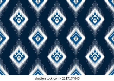 Ikat ethnic seamless pattern design. Tribal turkey African Indian traditional embroidery vector background. Aztec fabric carpet mandala ornament native boho chevron textile decoration wallpaper 