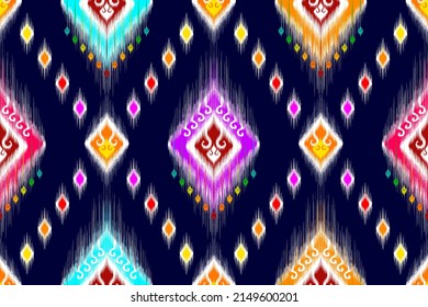 Ikat ethnic seamless pattern design Aztec fabric carpet mandala ornament ethnic chevron textile decoration wallpaper. Tribal turkey African Indian traditional embroidery vector illustration background