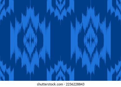  Ikat ethnic seamless pattern design . Aztec fabric native tribal boho carpet mandalas ornaments textile chevron wallpapers.  Tribal african american motif traditional embroidery vector background 
