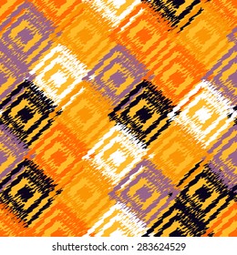 Ikat fabric seamless background. Vector tribal pattern