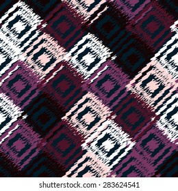 Ikat fabric seamless background. Vector tribal pattern