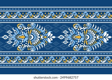 Ikat floral paisley design pattern on blue background.Ikat ethnic oriental embroidery traditional,Aztec style,abstract background,vector illustration.design for texture,fabric,clothing,decoration.