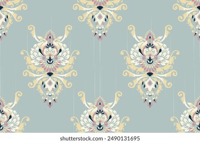 Ikat floral paisley design seamless pattern on blue background.Ikat ethnic oriental embroidery traditional,Aztec style,abstract background,vector illustration.design for texture,fabric,clothing,print