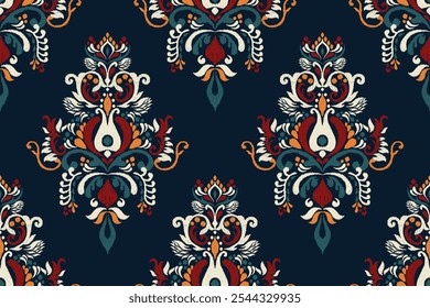 Ikat floral paisley design seamless pattern on blue background.Ikat ethnic oriental embroidery traditional,Aztec style,abstract background,vector illustration.design for texture,fabric,clothing,print.