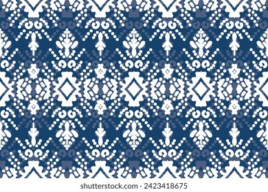 Ikat floral paisley embroidery on navy blue background.Ikat ethnic oriental pattern traditional.Aztec style abstract vector illustration.
