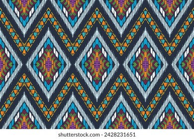 Ikat floral paisley embroidery on navy blue background.Ikat ethnic oriental pattern traditional.Aztec style abstract vector illustration.design for texture,fabric.