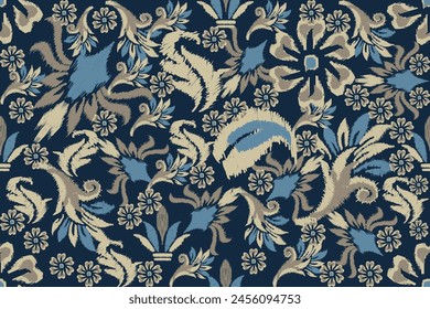 Ikat floral paisley embroidery on blue background.Ikat ethnic oriental seamless pattern traditional.Aztec style abstract vector illustration.design for texture,fabric,clothing,wrapping,decoration.