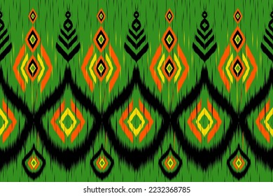Ikat Patrón geométrico étnico sin soldadura India Boho Aztec sobre fondo verde.Uso para tejido textil 
fondo, papel pintado, ropa 
y envoltura.