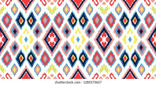 Ikat geometric folklore ornament with diamonds. Tribal ethnic vector texture. Seamless striped pattern in Aztec style. Folk  embroidery. Indian, Scandinavian, Gypsy, Mexican, African rug. 