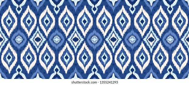 Ikat geometric folklore ornament with diamonds. Tribal ethnic vector texture. Seamless striped pattern in Aztec style. Folk  embroidery. Indian, Scandinavian, Gypsy, Mexican, African rug. 