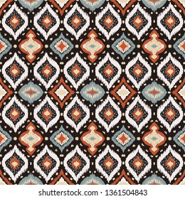 Ikat geometric folklore ornament with diamonds. Tribal ethnic vector texture. Seamless striped pattern in Aztec style. Folk  embroidery. Indian, Scandinavian, Gypsy, Mexican, African rug. 