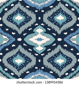 Ikat geometric folklore ornament with diamonds. Tribal ethnic vector texture. Seamless striped pattern in Aztec style. Folk  embroidery. Indian, Scandinavian, Gypsy, Mexican, African rug. 