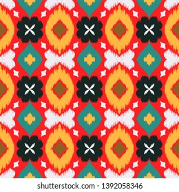 Ikat geometric folklore ornament with diamonds and flowers. African rug. Tribal ethnic vector texture. Seamless pattern in Aztec style. Folk  embroidery. Indian batik. Mexican decor.