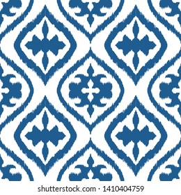Ikat geometric folklore ornament with diamonds. Damask rug. Tribal ethnic vector texture. Persian geo print. Seamless pattern in Aztec style. Folk embroidery. Gypsy, Mexican, African print. 