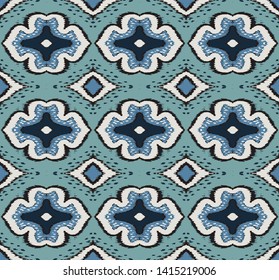 Ikat geometric folklore ornament with diamonds. Damask rug. Tribal ethnic vector texture. Persian geo print. Seamless pattern in Aztec style. Folk embroidery. Gypsy, Mexican, African print.