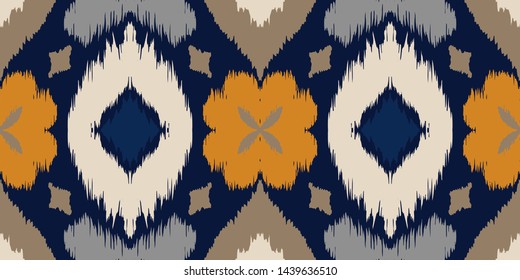 Ikat geometric folklore ornament with diamonds and flowers. African rug. Tribal ethnic vector texture. Seamless pattern in Aztec style. Folk embroidery. Indian batik. Mexican decor.