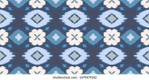Ikat geometric folklore ornament with diamonds and flowers. African rug. Tribal ethnic vector texture. Seamless pattern in Aztec style. Folk embroidery. Indian batik. Mexican decor.
