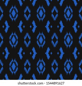 Ikat geometric folklore ornament with diamonds. Tribal ethnic vector texture. Seamless striped pattern in Aztec style. Folk embroidery. Indian, Scandinavian, Gypsy, Mexican, African rug.