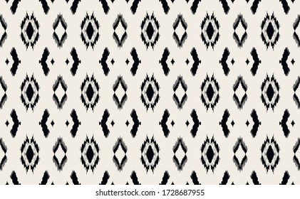 Ikat geometric folklore ornament with diamonds. Tribal ethnic vector texture. Seamless striped pattern in Aztec style. Folk embroidery. Indian, Scandinavian, Gypsy, Mexican, African rug.