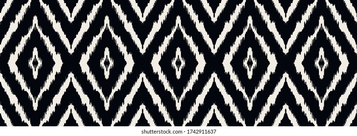 Ikat geometric folklore ornament with diamonds. Tribal ethnic vector texture. Seamless striped pattern in Aztec style. Folk embroidery. Indian, Scandinavian, Gypsy, Mexican, African rug.