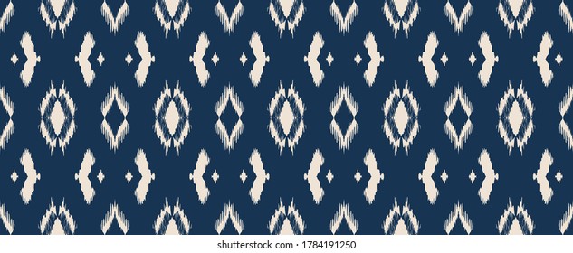 Ikat geometric folklore ornament with diamonds. Tribal ethnic vector texture. Seamless striped pattern in Aztec style. Folk embroidery. Indian, Scandinavian, Gypsy, Mexican, African rug.