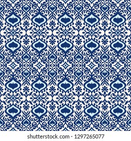 Ikat geometric folklore ornament. Oriental vector damask pattern. Ancient art of Arabesque. Tribal ethnic texture. Spanish motif on the carpet.  Aztec style.  Indian rug. Gypsy, Mexican  embroidery.