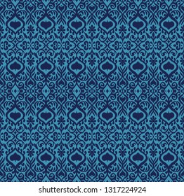 Ikat geometric folklore ornament. Oriental vector damask pattern. Ancient art of Arabesque. Tribal ethnic texture. Spanish motif on the carpet.  Aztec style.  Indian rug. Gypsy, Mexican  embroidery.