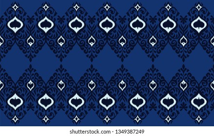Ikat geometric folklore ornament. Oriental vector damask pattern. Ancient art of Arabesque. Tribal ethnic texture. Spanish motif on the carpet.  Aztec style.  Indian rug. Gypsy, Mexican  embroidery.