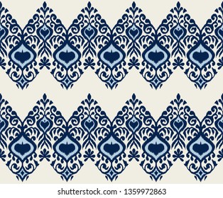 Ikat geometric folklore ornament. Oriental vector damask pattern. Ancient art of Arabesque. Tribal ethnic texture. Spanish motif on the carpet.  Aztec style.  Indian rug. Gypsy, Mexican  embroidery.