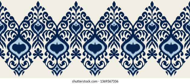 Ikat geometric folklore ornament. Oriental vector damask pattern. Ancient art of Arabesque. Tribal ethnic texture. Spanish motif on the carpet.  Aztec style.  Indian rug. Gypsy, Mexican  embroidery.