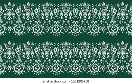 Ikat geometric folklore ornament. Oriental vector damask pattern. Ancient art of Arabesque. Tribal ethnic texture. Spanish motif on the carpet. Aztec style. Indian rug. Gypsy, Mexican embroidery.