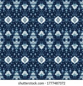 Ikat geometric folklore ornament. Oriental vector damask pattern. Ancient art of Arabesque. Tribal ethnic texture. Spanish motif on the carpet. Aztec style. Indian rug. Gypsy, Mexican embroidery.