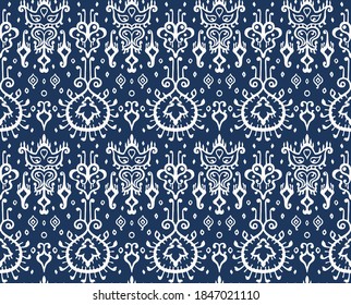 Ikat geometric folklore ornament. Oriental vector damask pattern. Ancient art of Arabesque. Tribal ethnic texture. Spanish motif on the carpet. Aztec style. Indian rug. Gypsy, Mexican embroidery.