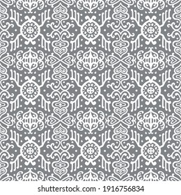 Ikat geometric folklore ornament. Oriental vector damask pattern. Ancient art of Arabesque. Tribal ethnic texture. Spanish motif on the carpet. Aztec style. Indian rug. Gypsy, Mexican embroidery.