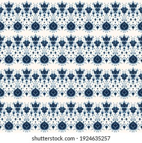 Ikat geometric folklore ornament. Oriental vector damask pattern. Ancient art of Arabesque. Tribal ethnic texture. Spanish motif on the carpet. Aztec style. Indian rug. Gypsy, Mexican embroidery.