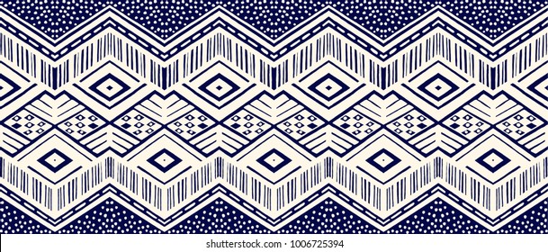Ikat geometric folklore ornament. Tribal ethnic vector texture. Seamless striped  pattern in Aztec style. Figure tribal  embroidery. Indian, Scandinavian, Gypsy, Mexican, folk pattern. 