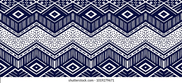 Ikat geometric folklore ornament. Tribal ethnic vector texture. Seamless striped  pattern in Aztec style. Figure tribal  embroidery. Indian, Scandinavian, Gypsy, Mexican, folk pattern. 