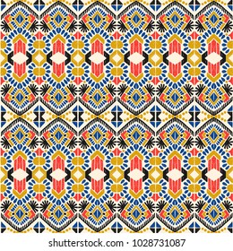 Ikat geometric folklore ornament. Tribal ethnic vector texture. Seamless striped  pattern in Aztec style. Figure tribal  embroidery. Indian, Scandinavian, Gypsy, Mexican, folk pattern. 