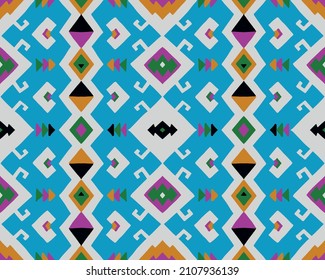 Ikat geometric folklore ornament. Tribal ethnic vector texture. Seamless striped pattern in Aztec style. Figure tribal embroidery. Indian, Scandinavian, Gypsy, Mexican, folk pattern.