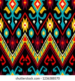 Ikat geometric folklore pattern. Ethnic folk ornament texture. Tribal mengikat textile. Aztec, Indian, Scandinavian, Gypsy or Mexican fabric.