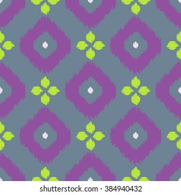 Ikat geometric seamless pattern. Green and purple color collection. Indonesian textile fabric tie-dye technique inspiration. Rhombus and drop shapes.