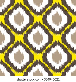 Ikat geometric seamless pattern. Yellow and brown color collection. Indonesian textile fabric tie-dye technique inspiration. Rhombus and drop shapes.