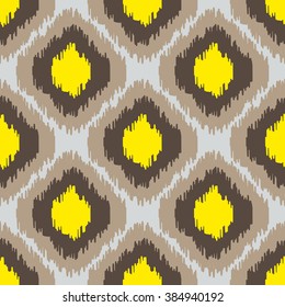 Ikat geometric seamless pattern. Yellow and brown color collection. Indonesian textile fabric tie-dye technique inspiration. Rhombus and drop shapes.