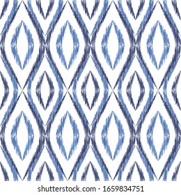 Ikat ogee seamless vector pattern illustration. Ethnic fabric print geometric ikat pattern. Simple ogee seamless repeating background. Tribal motifs ikat textile print design. Clothes ornament.