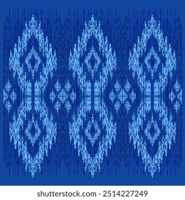 Ikat Ogee - seamless vector pattern with vibrant geometric motifs in Indigo tones, creating a traditional ethnic ornament effect. Tapestry style