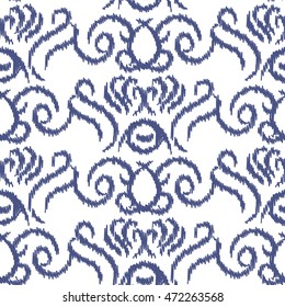 Ikat ogee vector seamless pattern. Abstract swirl background for fabric, print or wrapping paper. Indigo blue on white swirl design.