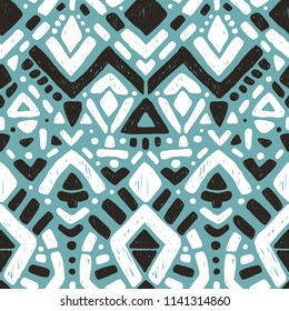 Ikat ornament. Tribal pattern in Aztec style. Hand Drawn folklore seamless pattern