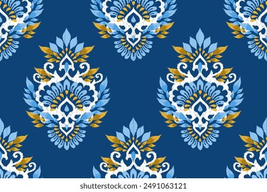 Ikat paisley design seamless pattern on blue background vector illustration.Ikat ethnic oriental embroidery traditional.Aztec style,abstract background.design for texture,fabric,clothing,decoration