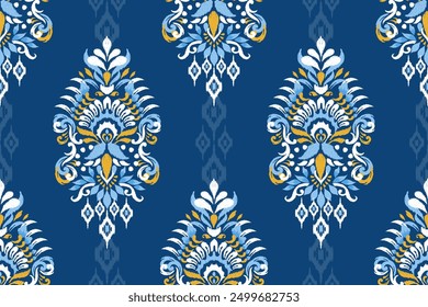 Ikat paisley design seamless pattern on blue background vector illustration.Ikat ethnic oriental embroidery traditional.Aztec style,abstract background.design for texture,fabric,clothing,decoration.