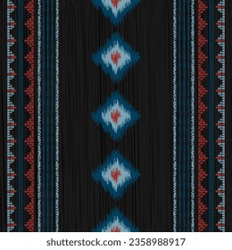 Ikat pattern for fabrics in stylish colors. Seamless pattern.